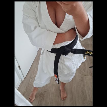 a woman wearing a black belt